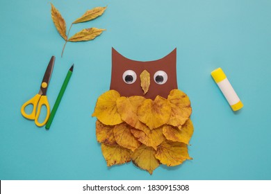 dry leaves applique art autumn. little child making autumn decoration "Owl" from leaves. Children's art project. DIY concept. Step-by-step photo instruction. Step 5 - Powered by Shutterstock