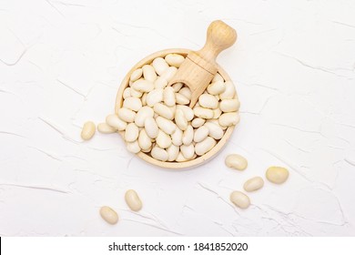 Dry Lima Bean Or Kidney Bean In Glass Jar. A Valuable Source Of Protein For A Healthy Vegan Diet. White Putty Background, Top View