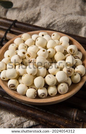 dry Lotus seed or lotus nut on wooden background