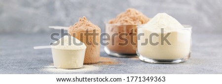 Dry mixture for preparation of sporting or dietary drink. Sports nutrition, fitness diet and food concept -  protein shake  powder  on grey background. Banner