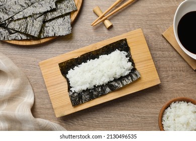 Dry Nori Sheet With Rice On Wooden Table, Flat Lay