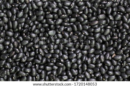 Dry organic Black Beans top view background or texture. Healthy spices, nuts, seeds and herbal products.