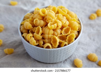 Dry Organic Gnocchi Pasta In A Bowl, Side View. Close-up.