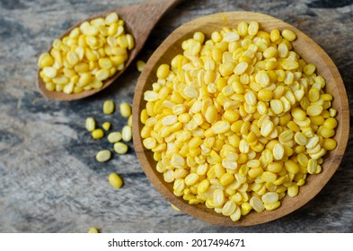 Dry Organic Yellow Mung Bean Seed Pile In Wooden Bowl And Spoon On Grunge Background