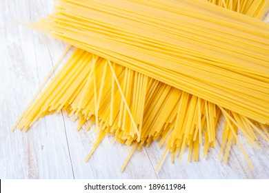 Dry Pasta On Wooden Table