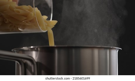 Dry Penne Falling Into Saucepan, Wide Photo