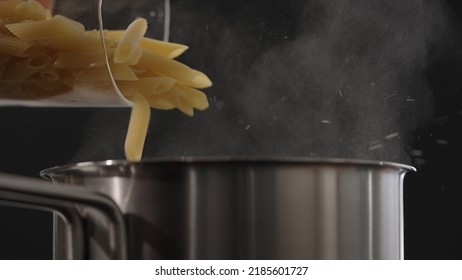 Dry Penne Falling Into Saucepan, Wide Photo