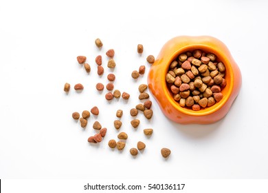 Dry Pet Food In Bowl On White Background Top View