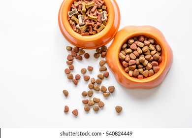 Dry Pet Food In Bowl On White Background Top View