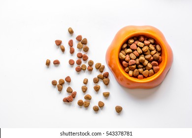 Dry Pet Food In Bowl On White Background Top View