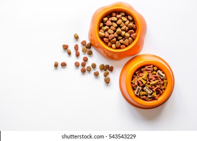 Dry Pet Food In Bowl On White Background Top View