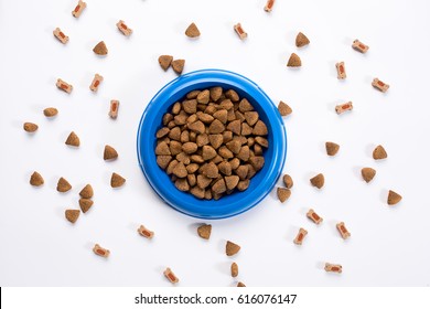 Dry Pet Food In Bowl On White Background Top View