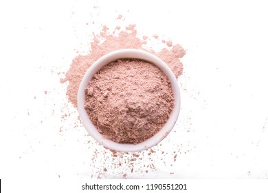 Dry Pink Clay Powder Mask For Face And Body  In Ceramic Bowl Isolated On White