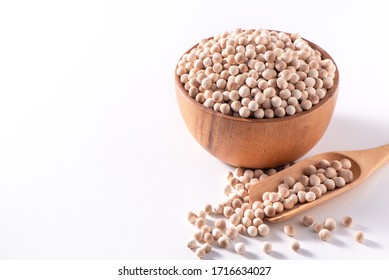 Dry Raw Brown Tapioca Pearls In A Wooden Bowl With Spoon Isolated On White Background, Close Up, Ingredient Of Making Bubble Boba Milk Tea.