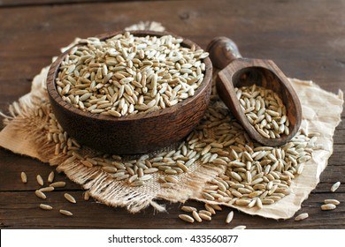 Dry Raw Rye Grain In A Bowl With A Spoon