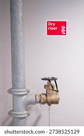 Dry riser landing valve within office building
