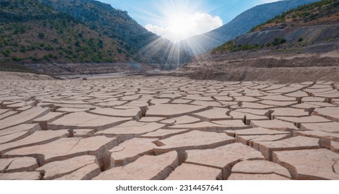 Dry riverbed with cracked ground of bottom