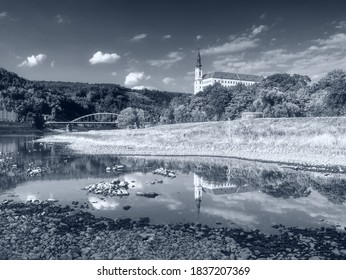 Dry Riverbed Of River Elbe In Decin, Czech Republic. Castle Above Old Railway Bridge