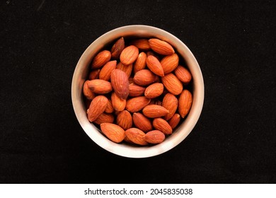 Dry Roasted Almonds In A Metal Bowl Seen From Overhead; Salted Snacks For Protein And A Healthy Diet.