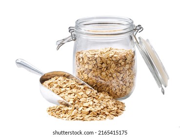 Dry rolled oat flakes spill out of a glass storage jar isolated on white background. - Powered by Shutterstock