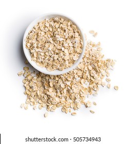Dry rolled oatmeal in bowl isolated on white background. Top view. - Shutterstock ID 505734943