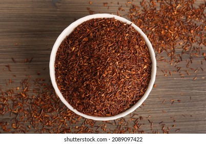 Dry Rooibos Leaves On Wooden Table, Flat Lay