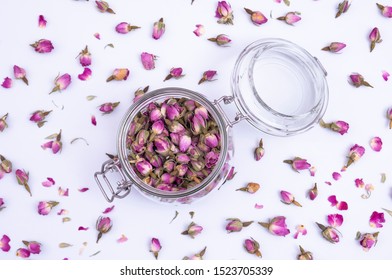 Dry rose buds for tea on white background. - Powered by Shutterstock