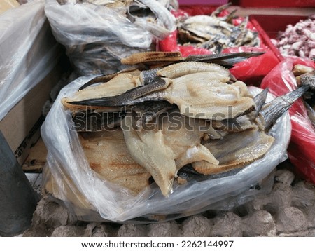 Dry salted cod fish such as kippered herring or dried and salted cod, is fish cured with dry salt and thus preserved for later eating