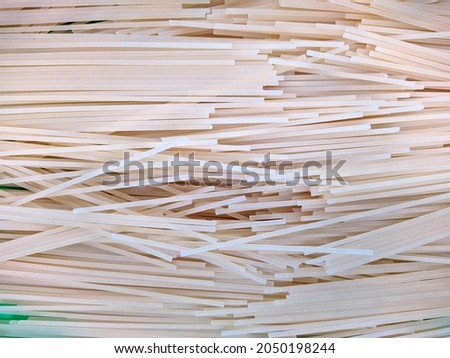 dry spaghetti background closeup photo top view