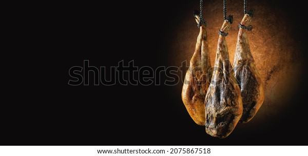 Dry Spanish ham, Jamon Serrano, Bellota, Italian\
Prosciutto Crudo or Parma ham.Slicing Spanish íberic ham. Spanish\
jamon and traditional food.