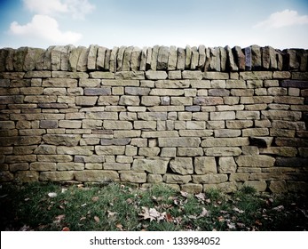 Dry Stone Wall With Fallen Leaves