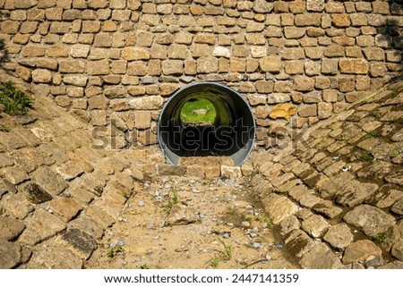 Similar – Image, Stock Photo Look through stone pipes with resistant glaze placed on the ground in front construction site