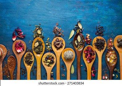 Dry Tea With In Wooden Spoons. Top View