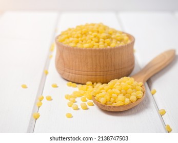 Dry toasted ptitim pasta close-up on a wooden spoon - Powered by Shutterstock