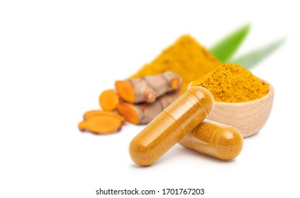 dry Turmeric powder in capsule  isolated on white background.