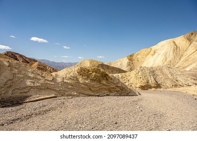 Dry Wash Turns Around Mud Layered Ridge In Gower Gulch in Death Valley National Park