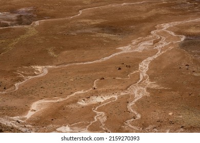 Dry Washes Splinter Out Below Blue Mesa over desert hillside