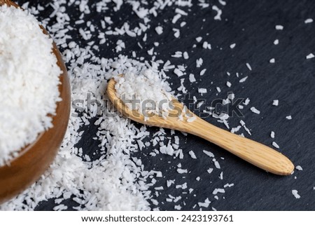 dry white coconut chips for adding to desserts, finely chopped coconut pulp dried in sugar syrup
