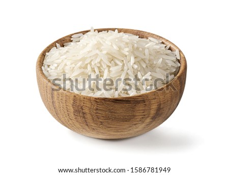 Dry white long rice basmati in wooden bowl isolated on a white background.