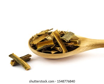 Dry Willow Bark Lies In A Wooden Spoon On A White Background.