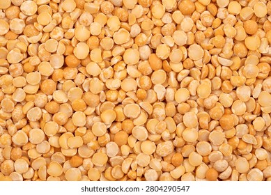 Dry yellow split peas background	