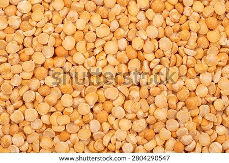 Dry yellow split peas background	