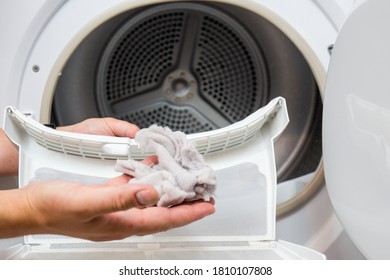Dryer filter, dirty and needs to be cleaned, clothes dust has gathered in one place