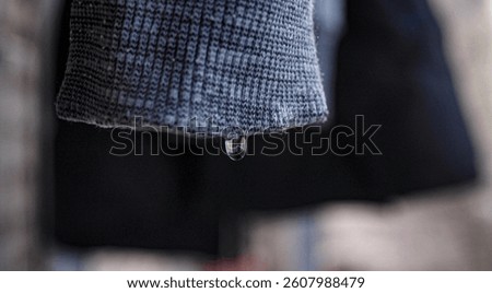 Drying clothes. A drop falling from a sleeve