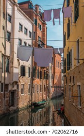 Drying Clothes On The Line Between Buildings In Italy