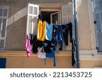 drying clothes on an old window