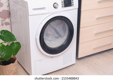 Drying machine in the house for drying linen, clothes, bed linen. Dryer.