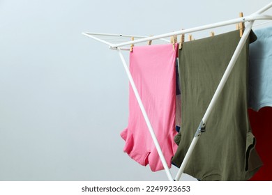 Drying rack with clothes, space for text