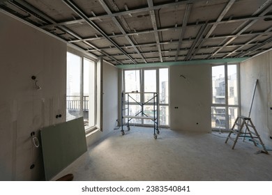 Drywall installation work in progress by construction workers at construction room. easiest and cheapest way to do partition for interior wall. New home for under construction. protection building 