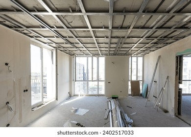 Drywall installation work in progress by construction workers at construction room. easiest and cheapest way to do partition for interior wall. New home for under construction. protection building 